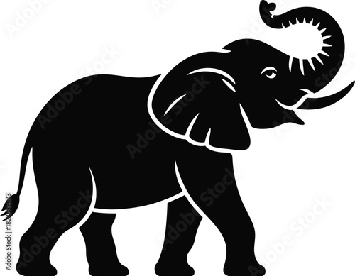 Black silhouette of an elephant with trunk raised animal