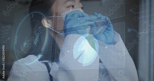Adjusting Korean doctor in white lab coat, stethoscope and blue gloves, fitting mask in clinic HUD