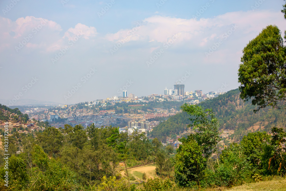 Obraz premium View through valley of urban skyline of African city