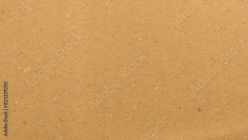 Brown paper texture background for presentation product. Pastel peach illumination, grainy color gradient background.