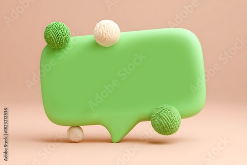 Green speech bubble with textured spheres on a soft pink background