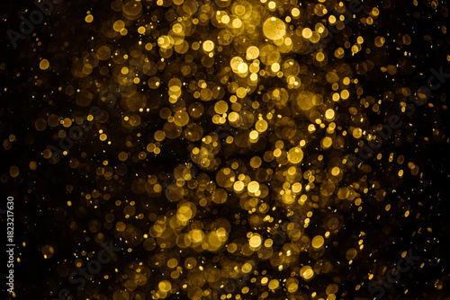 Blurred photo with golden dots visible glittering, shining brightly look and feel luxurious