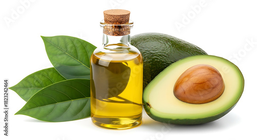 Glass bottle of golden avocado oil with fresh avocado fruit and green leaves isolated on white background
