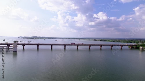 Wallpaper Mural Ghataprabha main bridge with river, trees and cloud sky. day time, trucking shot, drone shot, 4k. Torontodigital.ca