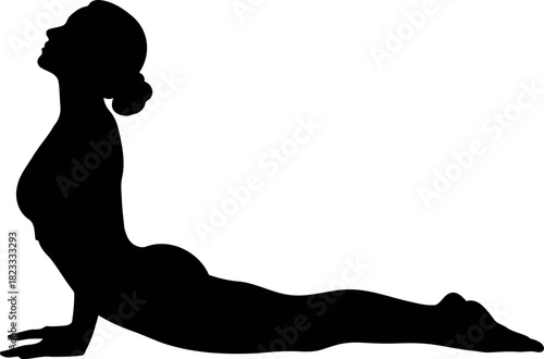 Silhouette of woman in graceful cobra yoga pose for wellness.