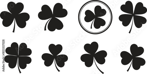 Set of diverse clover leaf symbols including shamrocks and four-leaf clovers, presented as solid black icons on a clean white background, symbolizing luck, nature, and st. patrick's day traditions, pe