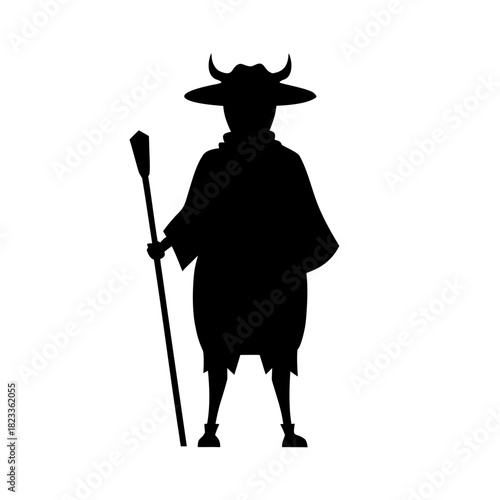 Mysterious horned figure holding a staff silhouette