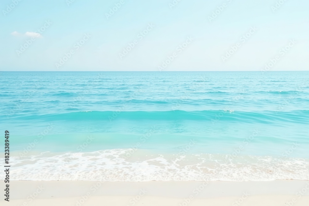 Fototapeta premium Serene Coastal Scene Ocean Waves Gently Lap the Pristine Sandy Shore Under a Clear Sky