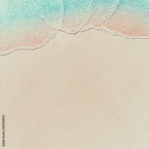 Minimalist beach scene with copy space, featuring the waterline where the clear blue water meets the soft sand. Ideal for travel and holiday promotions.