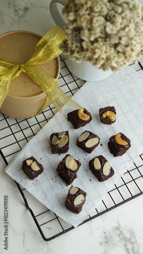 Selective focus almond brownies on cooling rack. White background