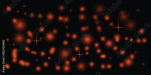 Abstract orange bokeh lights and stars on a dark background for festive design