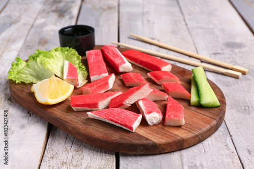 Board with tasty crab stick...