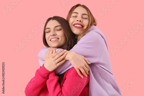 Female friends hugging on p...