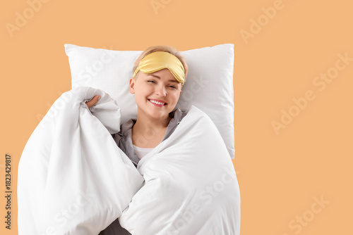 Young woman with pillow and...