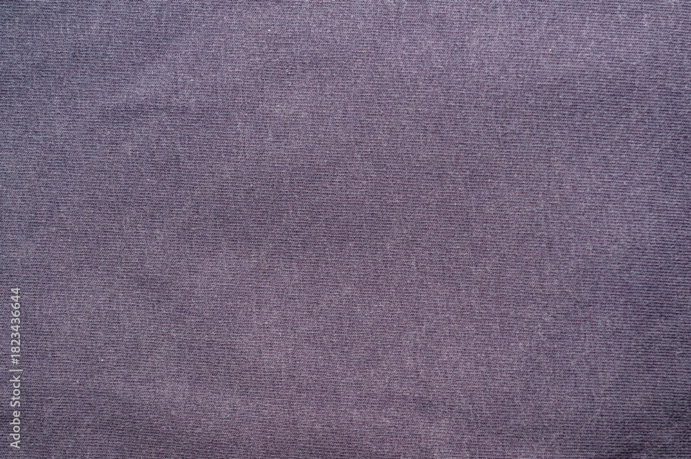 Fototapeta premium Close-up of a textured dark purple fabric background