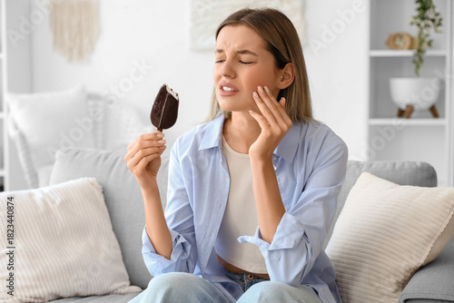 Young woman with cold ice c...