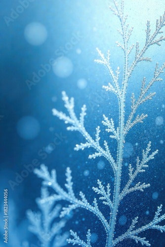 Frozen Branch Detailed Close-Up Showing Delicate Ice Crystals Against a Soft Blue Background with Sparkling Particles