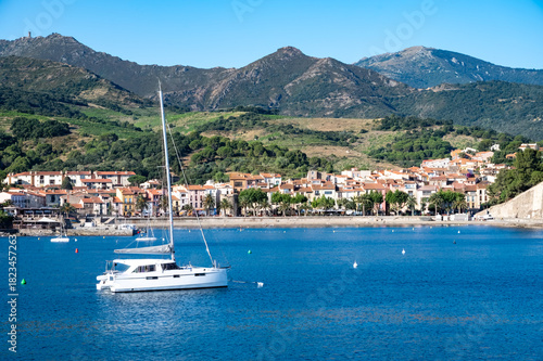 Fototapeta Naklejka Na Ścianę i Meble -  View of colourful Collioure, narrow streets and yellow, pink, orange houses, summer vacation destination town with historical buidings and beaches, Pyrenees-Orientales, France