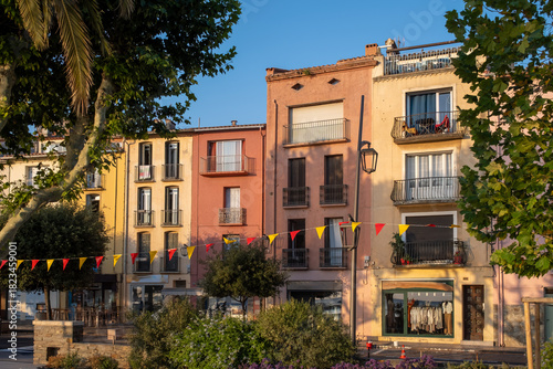 Fototapeta Naklejka Na Ścianę i Meble -  Morning view of colourful Collioure, narrow streets and yellow, pink, orange houses, summer vacation destination town with historical buidings and beaches, Pyrenees-Orientales, France