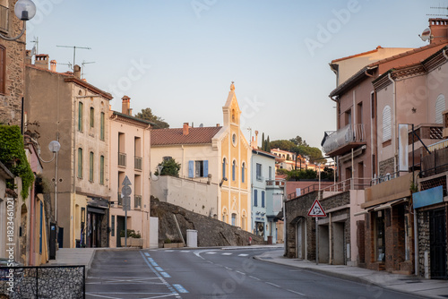 Fototapeta Naklejka Na Ścianę i Meble -  Morning view of colourful Collioure, narrow streets and yellow, pink, orange houses, summer vacation destination town with historical buidings and beaches, Pyrenees-Orientales, France
