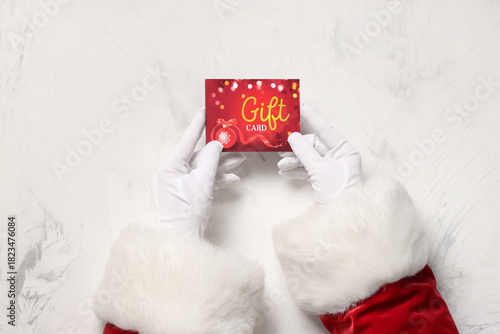 Santa Claus hands with gift...