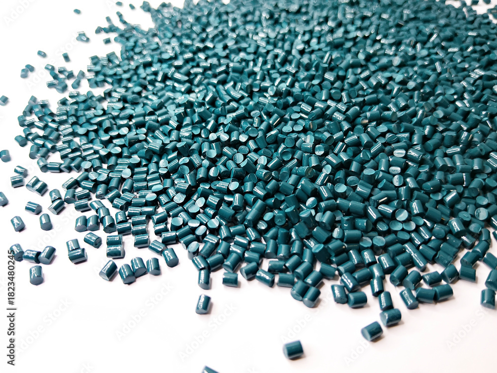 Obraz premium plastic masterbatch, green masterbatch granules as virgin polymer resin pigment, poured into white background media, suitable for industrial plastic company profile product catalog design, top view