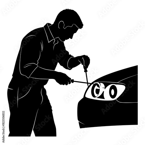 Auto mechanic repairing car headlight with screwdriver for professional automotive service
