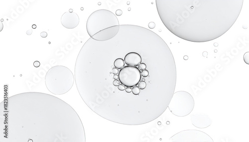 Transparent, spherical orbs of varying sizes float against a black background