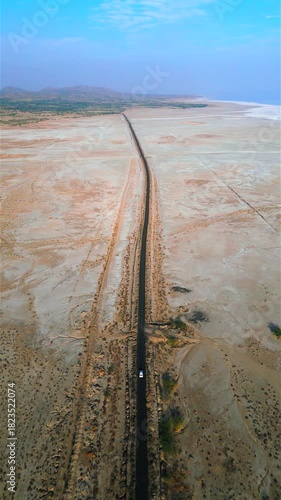 Aerial view of the Road to Heaven, Dholavira, stretching across the White Rann of Kutch, India, Stunning desert landscape with endless salt flats and a serene sky, Road to heaven, Rann of Kutch