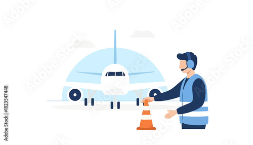 Airport worker guiding plane with orange cone at gate area