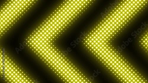 Seamless pattern of glowing yellow led lights forming chevron or arrow shapes against a dark background 4k video