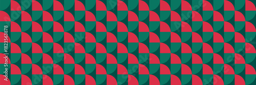 Festive seamless geometric pattern with red and green shapes, bright holiday-inspired design ideal for Christmas backgrounds and seasonal textiles