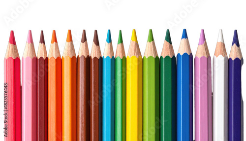 A spectrum of colored pencils aligned side-by-side against a stark black background