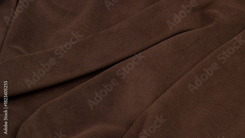 Fleece fabric brown top view. Texture of textile fleece bedspread.