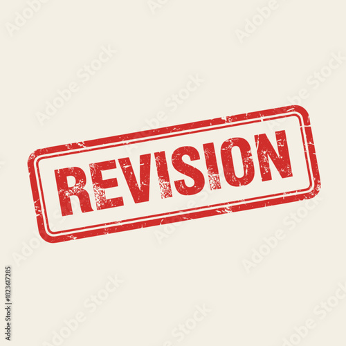 A red rubber stamp with the word REVISION imprinted on it.