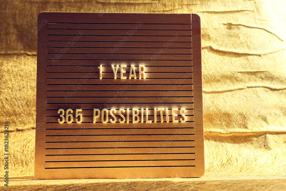 Obraz premium Board with the text 1 year 365 possibilities. Motivation and inspiration concept