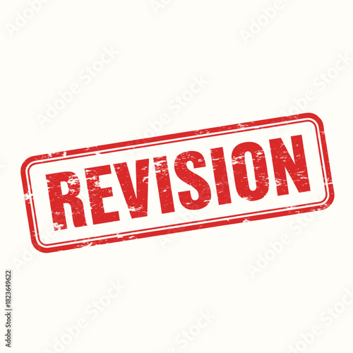 A red rectangular rubber stamp with the word "REVISION" in capital letters, used for marking documents.