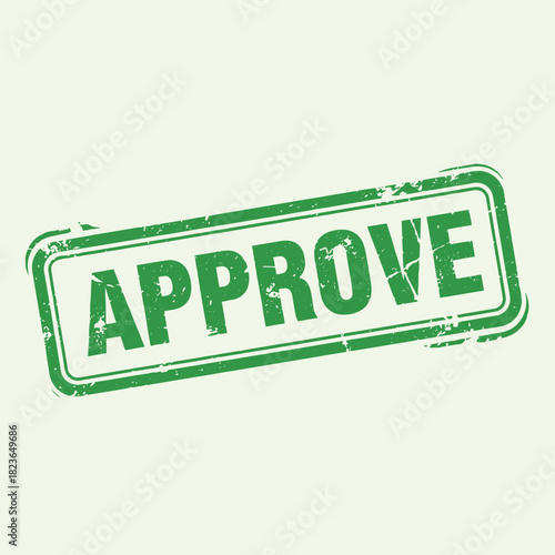 Green rubber stamp with the word APPROVE on a light background.