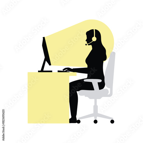 Helpdesk operator with headset at computer screen