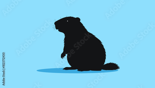 Silhouette of a beaver standing on its hind legs against a blue background.