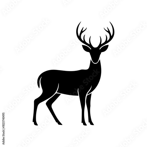 Silhouette of a deer with large antlers standing