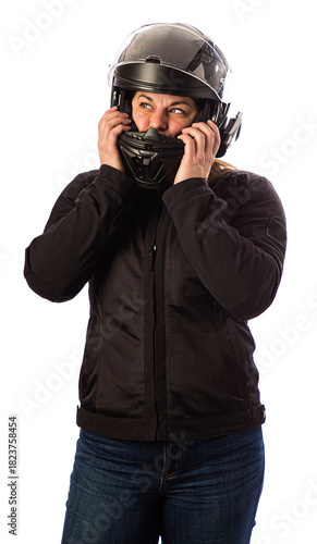 Adjusting her motocycle helmet