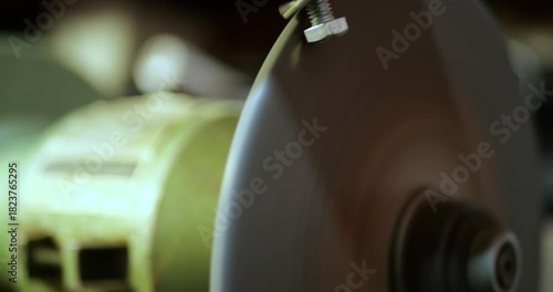 Grinding Machine High RPM Touching Metal Bolts, Bright Sparks Erupting from Friction with Sound, Industrial Workshop Power Tool Operation, Manufacturing Metal Fabrication Process