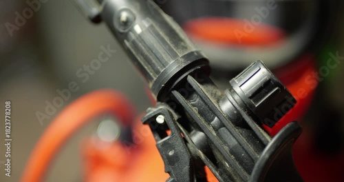 Air Release Button On Pre-Inflated Hand Pump Close-Up Controlled Air Pressure Manual Operation Inflatable Objects Demonstration Real-Time Mechanical Action Sound Included