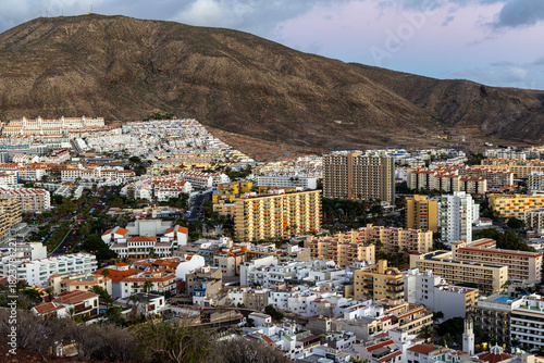 Panorama of the town of Los Cristianos with a volcano in the background. Tenerife, Canary Islands