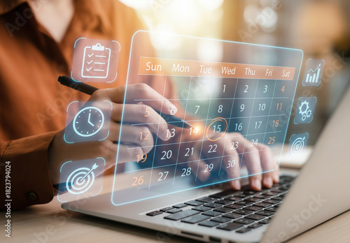 Person using digital calendar to schedule events. Suitable for productivity, time management, organization, and scheduling concepts in designs.
