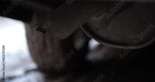 Car Exhaust Pipe Tip Close Up Emitting Vapor And Water Drops After Fuel Combustion Cold Winter Day Snow On Road Engine Performance Diagnosis Vehicle Health Check And Emission System Control