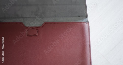 Brown Eco-Leather Magnetic Case Close Up Opening Closing With Distinctive Snap Sound Built-In Magnetic Filler Bar Secure Hold Modern Phone Accessory Tech Gadget Protection Everyday Carry Essential