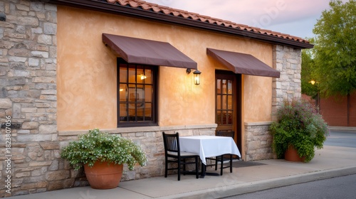Fototapeta Naklejka Na Ścianę i Meble -  Small restaurant with a table and chairs outside