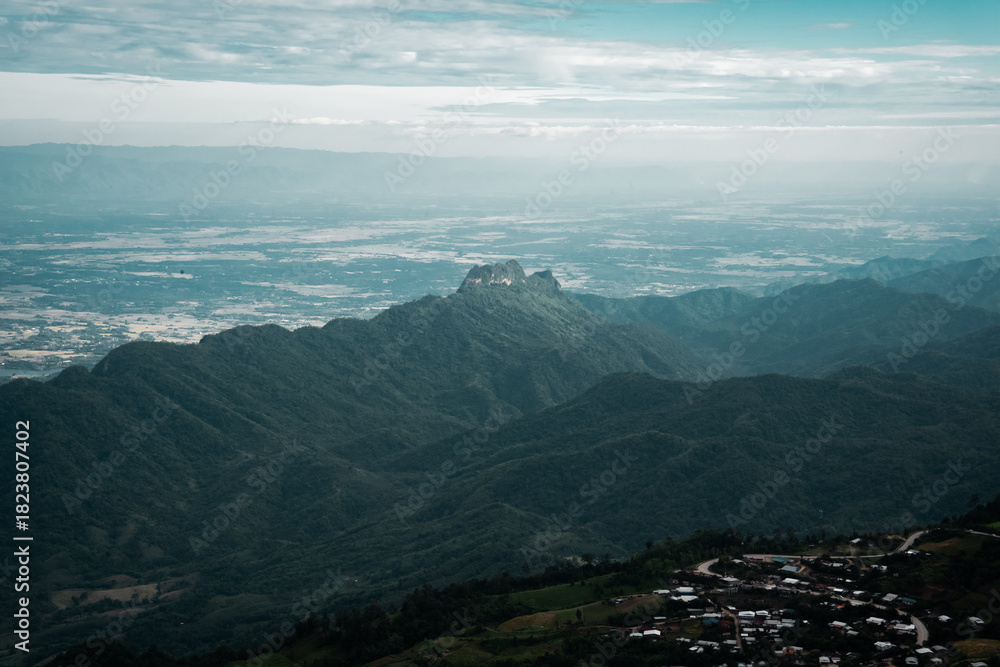 Naklejka premium Beautiful mountain landscape with sea of mist, winding road, and resorts at Phu Thap Boek, Thailand.
